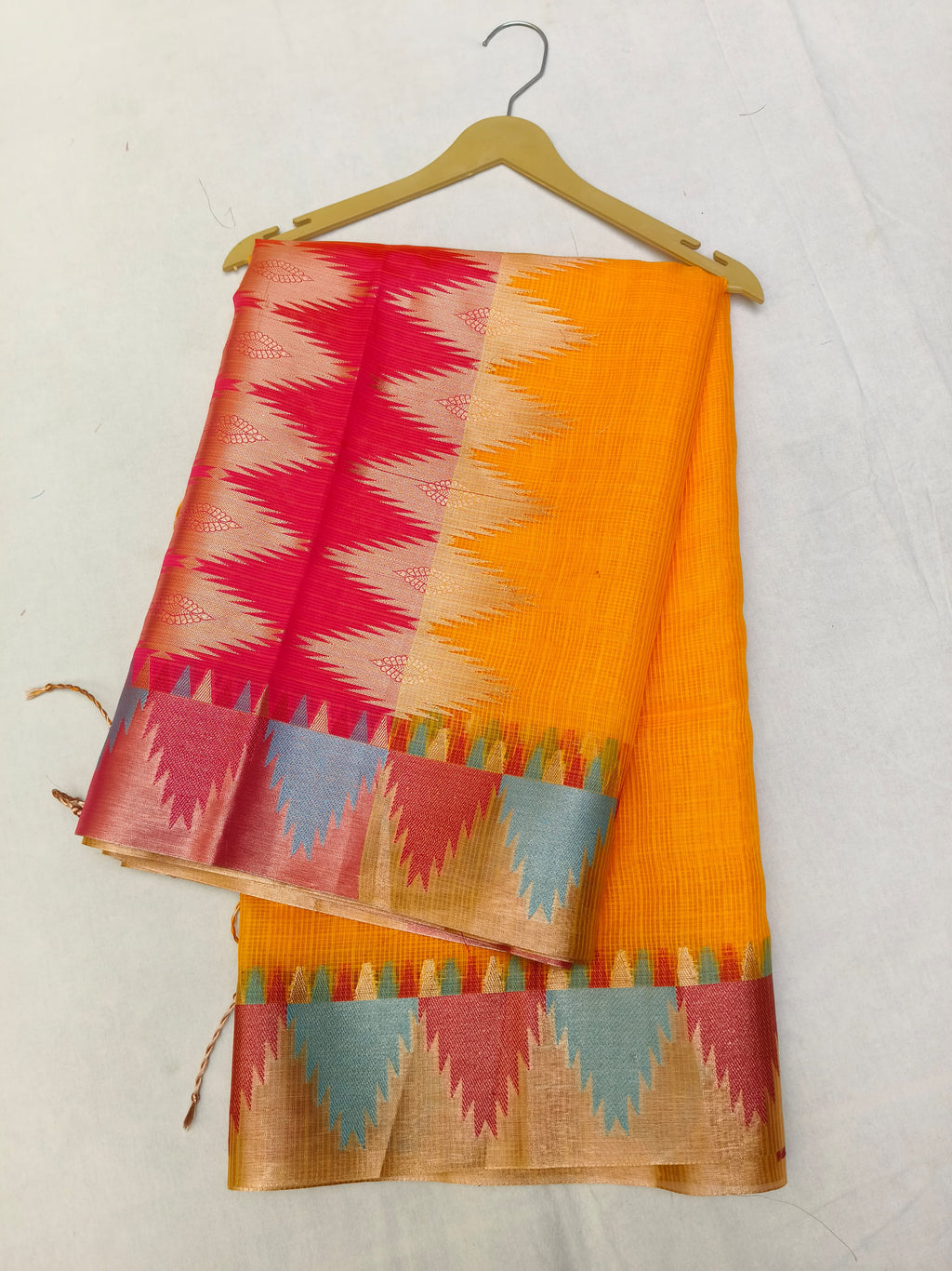 Colorful saree with geometric pattern on a white background