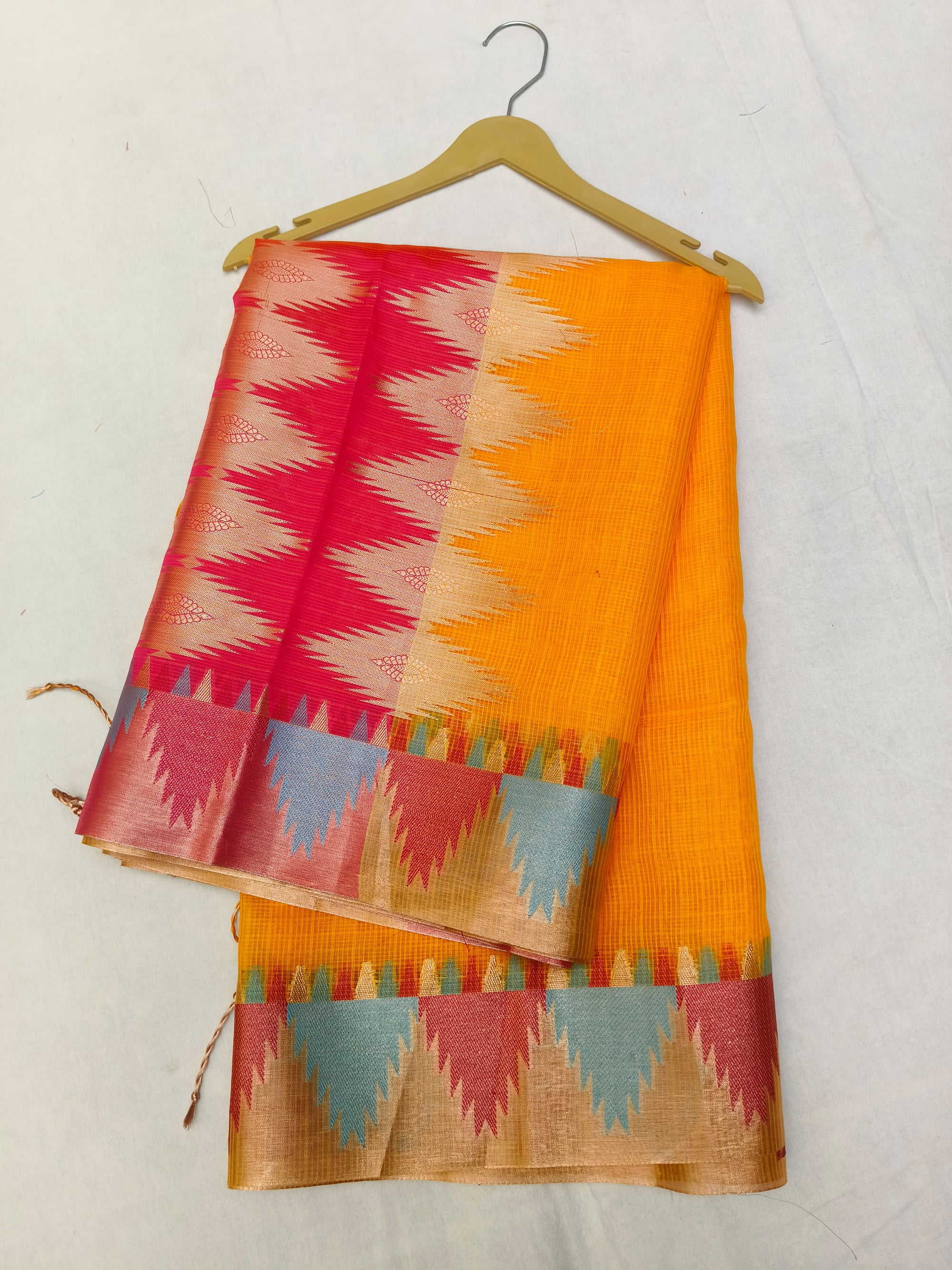 Colorful saree with geometric pattern on a white background